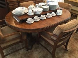 Beautiful wood top with one leaf in as shown can remove for smaller size or add the second leaf for a larger table. We will sell the chairs separately as they are game table style, way comfortable on rollers IF that is what u want, six in total