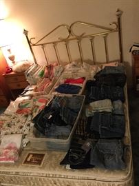 Queen size headboard with mattress set, ladies small jeans, some new, sheet sets, some fun vintage 