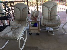 Two swivel rockers that match table set, sold as set including ottoman