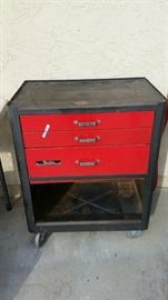 Red and black rolling tool chest, lower door is there and works great