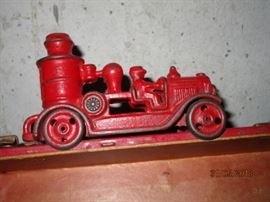 Antique cast iron red fire pumper