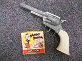 VINTAGE FILM W/TOY HAND GUN.