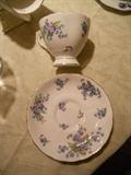 ONE OF MANY TEA CUPS AND SAUCER.