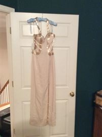 Brand new with tags dress perfect for prom. Size 4