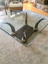 Maitland Smith horn leg/glass top  (40” by 50”) coffee table