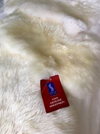 A few natural sheepskin throw rugs 