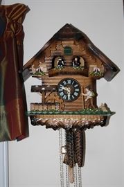 There is a lot going on in this Vintage Cuckoo Clock!  