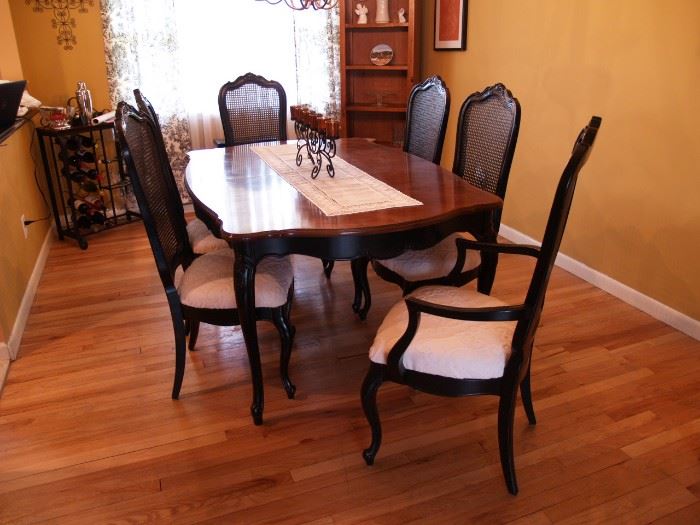 Antique mahogany dining room set includes 6 chairs and 2 leaves.  Newly upholstered.  Asking $1500