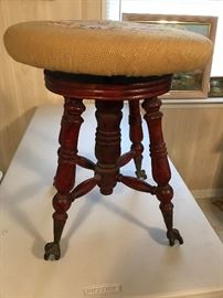Glass ball and claw piano stool
