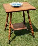 Super American oak parlor lamp table with glass ball and claw feet and bronze shelf supports