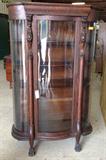The Best, American oak curved glass china cabinet with carved griffins