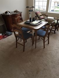 Folding table with upholstered seat chairs