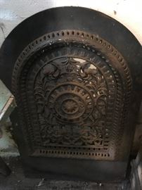 One of several cast iron grates and fire place covers