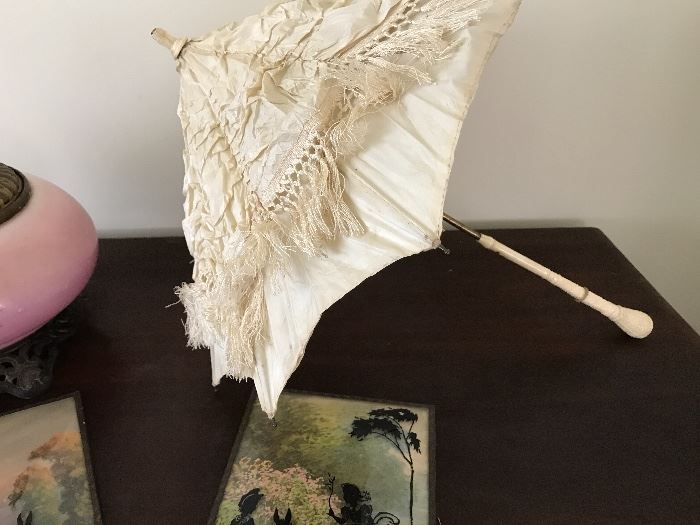 Very old silk parasol with ivory handle