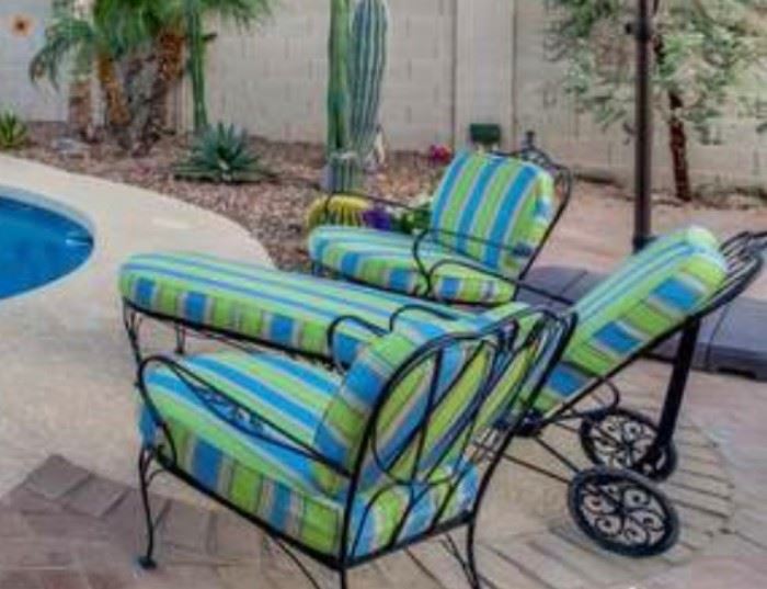 Bright and happy looking, comfortable, spotless patio set. Custom made Sunbrella cushions. Perfect for lounging around the pool or watching the sun go down.