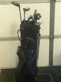 Men's golf clubs and bag.