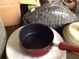 Signed cookware and stone fish