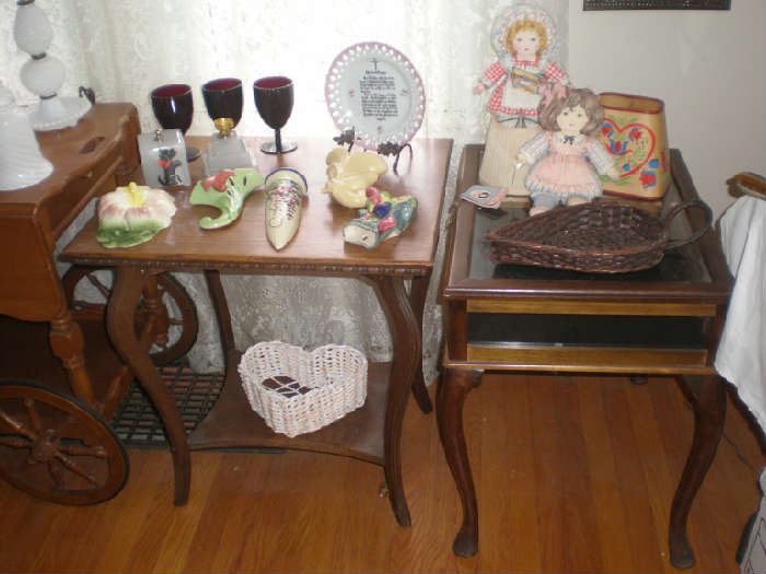 Smaller parlor table and side table with opening glass top for display, wall pockets, rub goblets, dolls, shades, baskets.