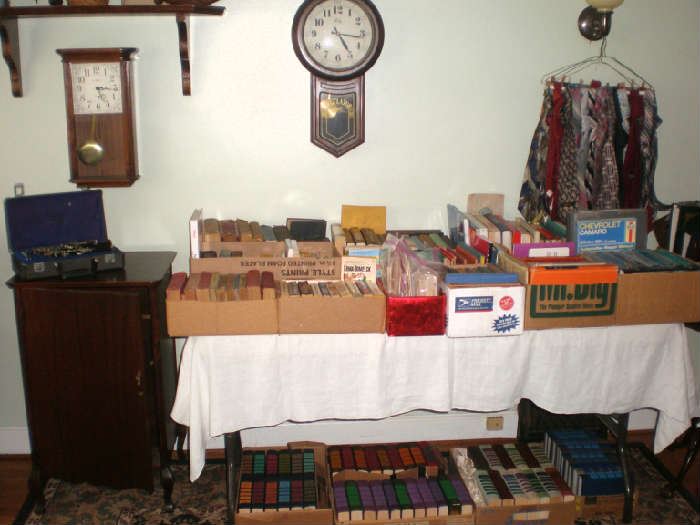 Clarinet, battey op wall clocks, ties, books, including decoration reader's digest condensed books by the box.