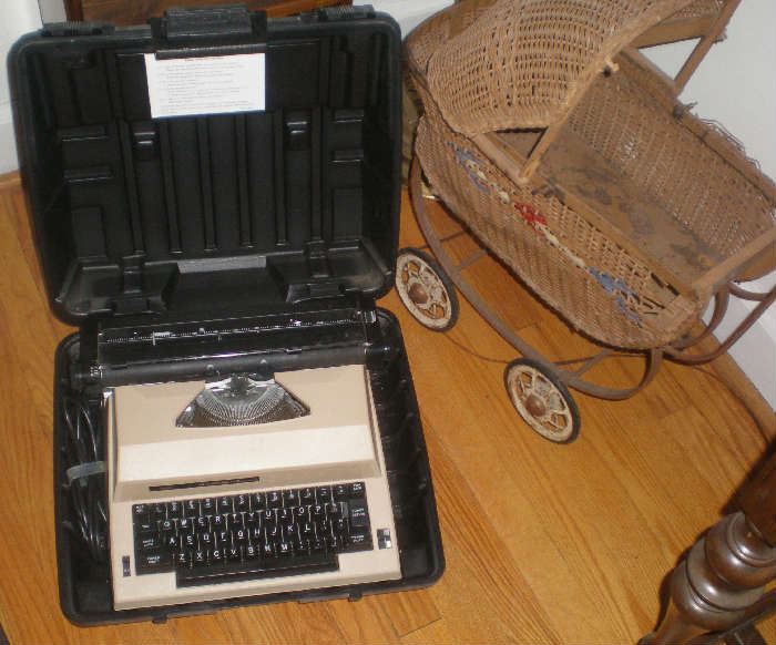 Doll buggy, electric typewriter.