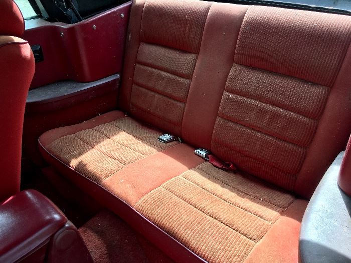 Mustang back seat, red interior.