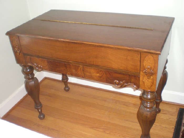 The spinet desk closed up, notice the beautiful legs and detail and trim in the wood.