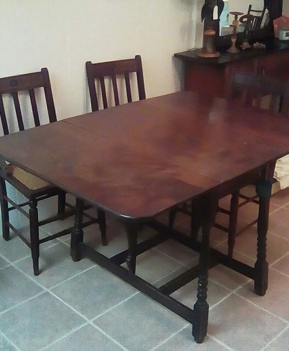 Gate leg table with 4 cane bottom chairs