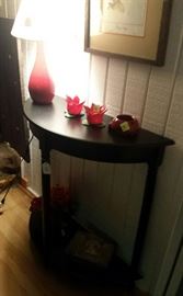 half moon black table, red lamp