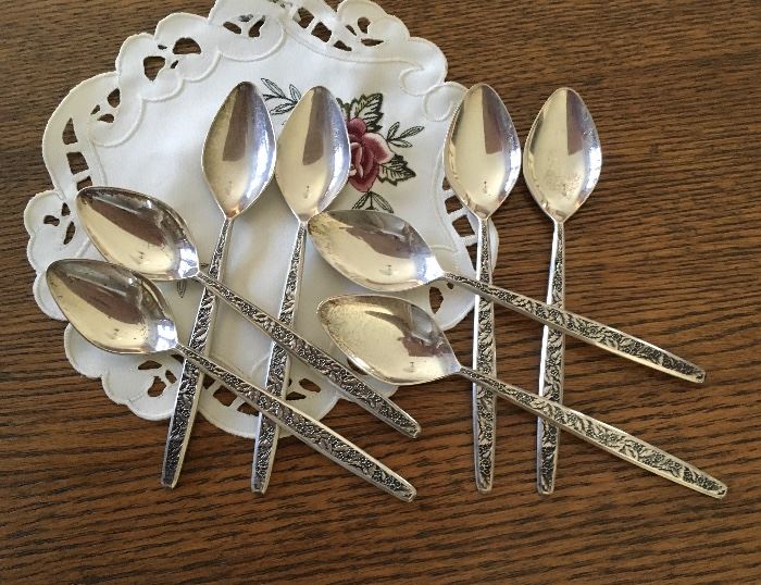 Vintage place setting of flatware spoons shown for pattern. 