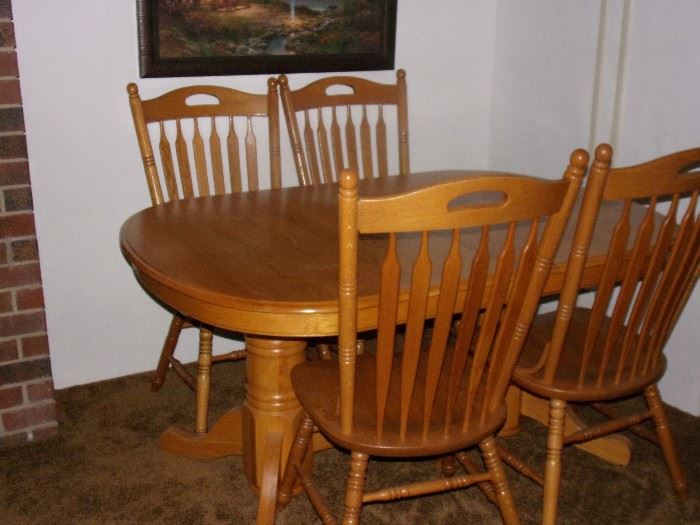 Oak dual pedestal table and four chairs