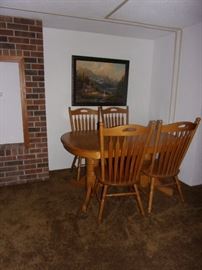 Oak dual pedestal table and four chairs