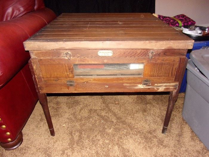 Unique and antique egg incubator table.