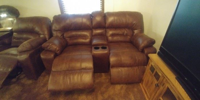 Bomber style dual power reclining  loveseat and sofa/couch with cup holders and storage compartments from Nebraska Furniture Mart