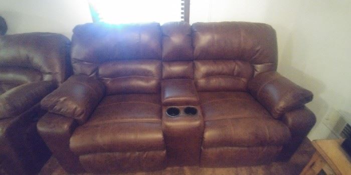 Bomber style dual power reclining  loveseat and sofa/couch with cup holders and storage compartments from Nebraska Furniture Mart