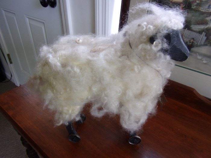 Cute sheep with real wool, wheels on feet