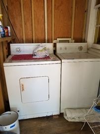 older model gas dryer and washing machine