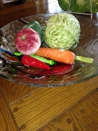 Glass bowl full of ceramic vegetables