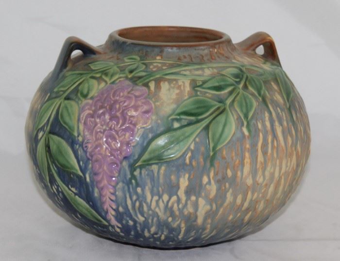 Roseville Pottery "Wisteria" Vase Art pottery Zanesville, Ohio, pattern date 1933 Round rim on bulbous form with two small, angular handles at top, decorated with wisteria flowers and leaves