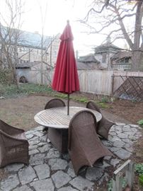 Teak table with 2 wicker chairs and umbrella