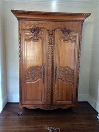 The carvings on this wardrobe match the sofa