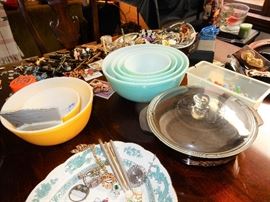 Vintage Pyrex nesting bowls and other objects, marbles, jewelry, watches, religious items.