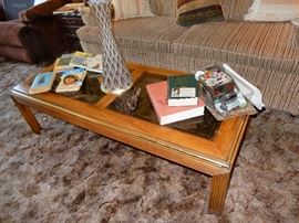 cofee table. sewing kit, mcm lamp, books on nursing.