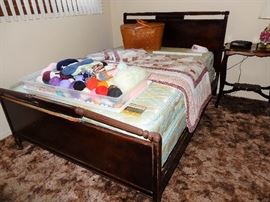 Overview of bedroom # 1, full-size bed with 2 dressers, clothing, hosiery and knitting/crochet items.