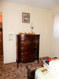 Tall Dresser filled with clothing