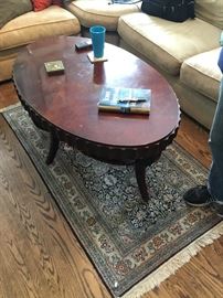 Coin edge coffee table with rug from India