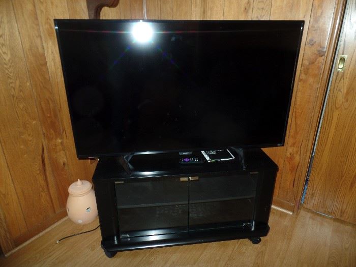 Sharp flat screen TV and TV stand
