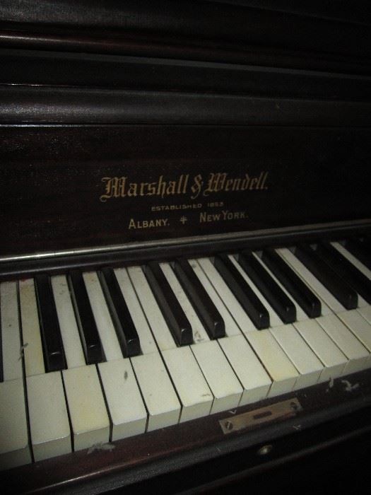 Marshall & Wendell upright piano with ivory keys vg condition