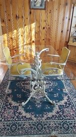 Glass top table with metal base, two chairs. Lee L. Woodard and Sons.
