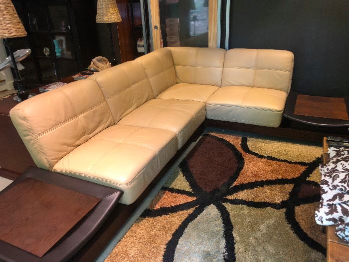 Mid Century Modern Leather sectional with attachable end tables. This is really a unique and beautiful sofa!