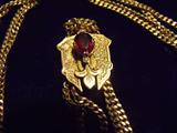 14K gold watch fob with red stone.